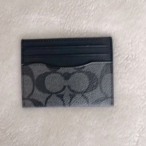 Coach men’s card holder never used.